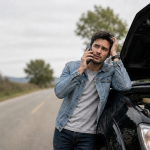 Driver calling for help after a car breakdown