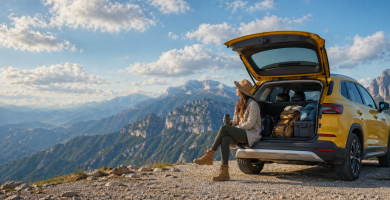 Driver with SUV on a mountain road trip, considering full coverage car insurance