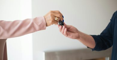 Car keys being handed over to someone borrowing another person’s car