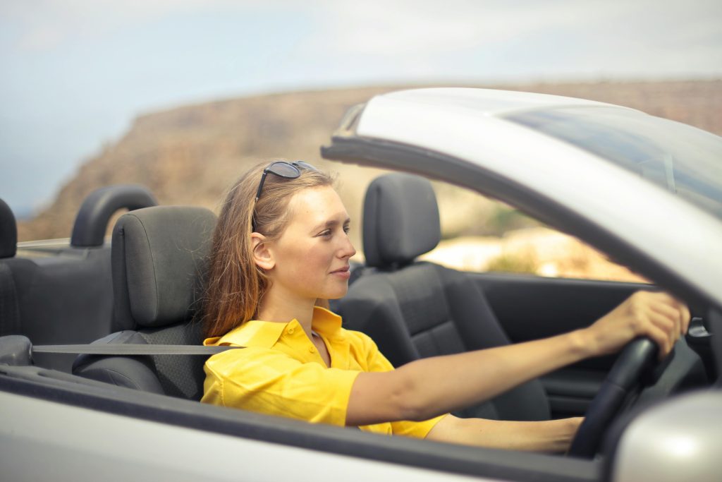Driver comparing car insurance premium and deductible costs