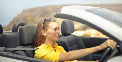Driver comparing car insurance premium and deductible costs