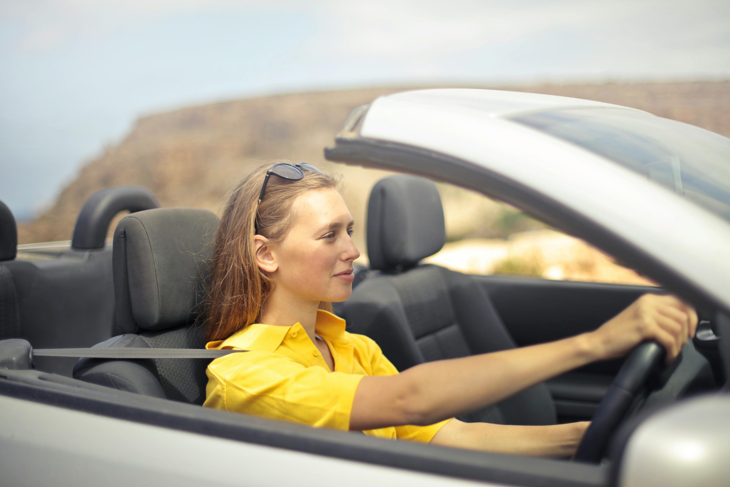 Driver comparing car insurance premium and deductible costs