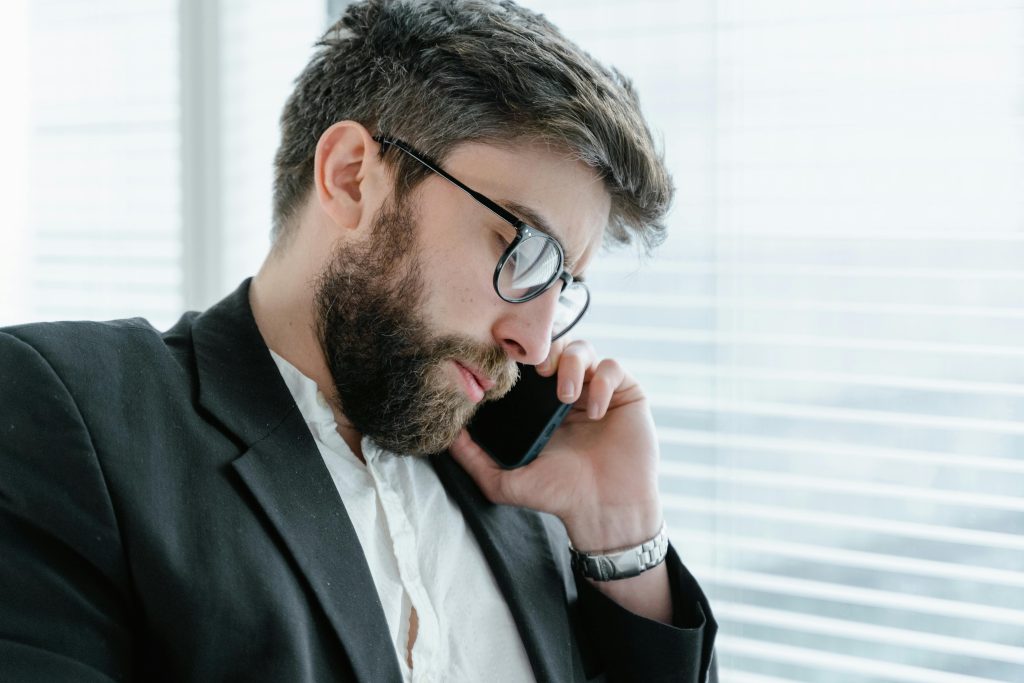 Driver calling insurance company about canceling car insurance