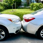 Two cars damaged in a minor collision