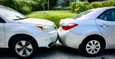 Two cars damaged in a minor collision
