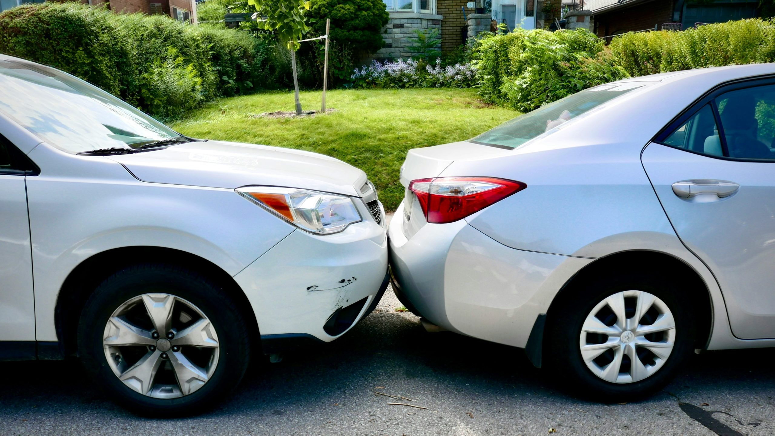 Two cars damaged in a minor collision