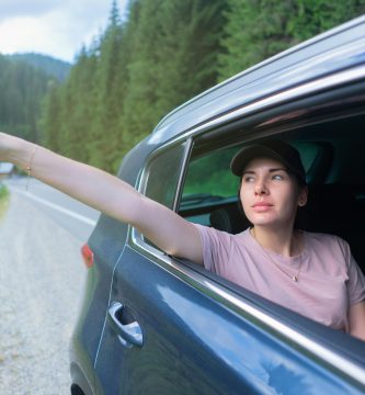Driver confused about car insurance myths on a road trip