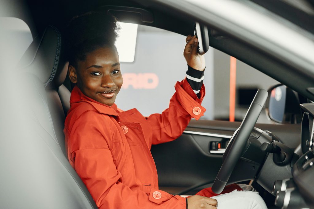 Teen driver sitting in a car