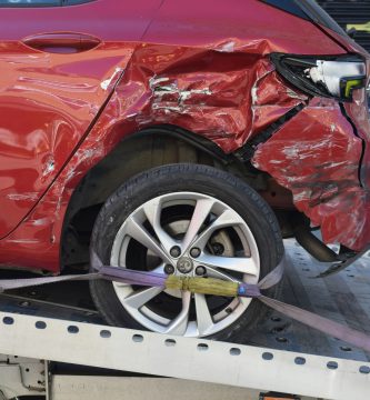 Damaged car being towed after an accident