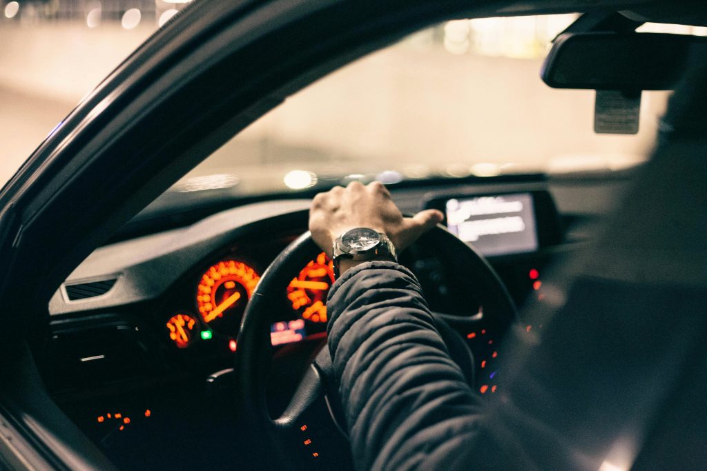 Driver in a car reviewing insurance coverage options