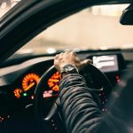 Driver in a car reviewing insurance coverage options