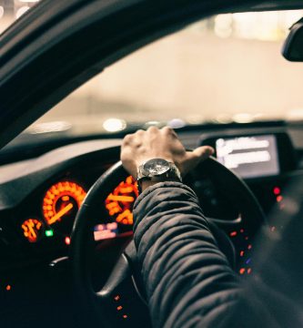 Driver in a car reviewing insurance coverage options
