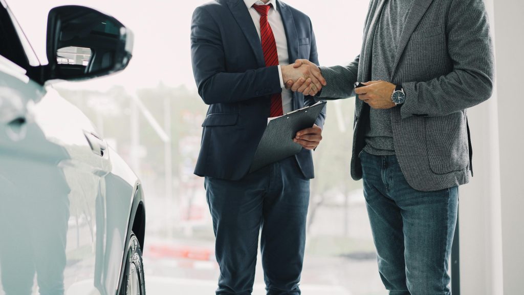 Driver reviewing rental car insurance coverage before taking a car