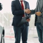Driver reviewing rental car insurance coverage before taking a car