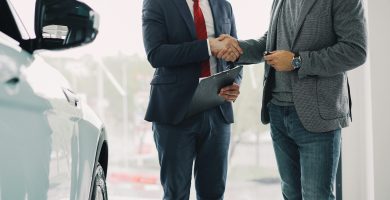 Driver reviewing rental car insurance coverage before taking a car