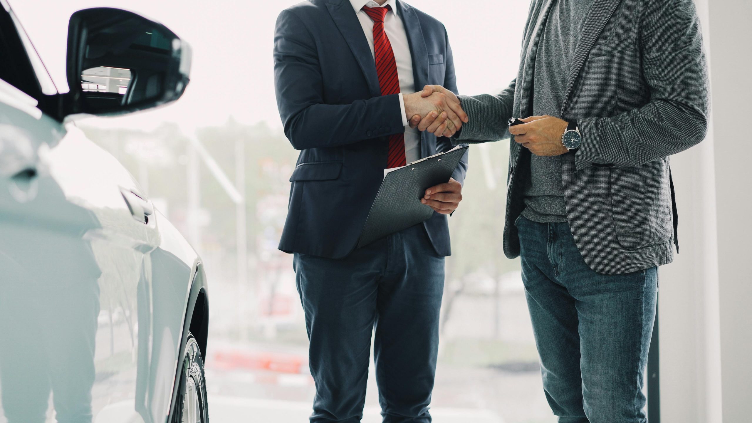 Driver reviewing rental car insurance coverage before taking a car