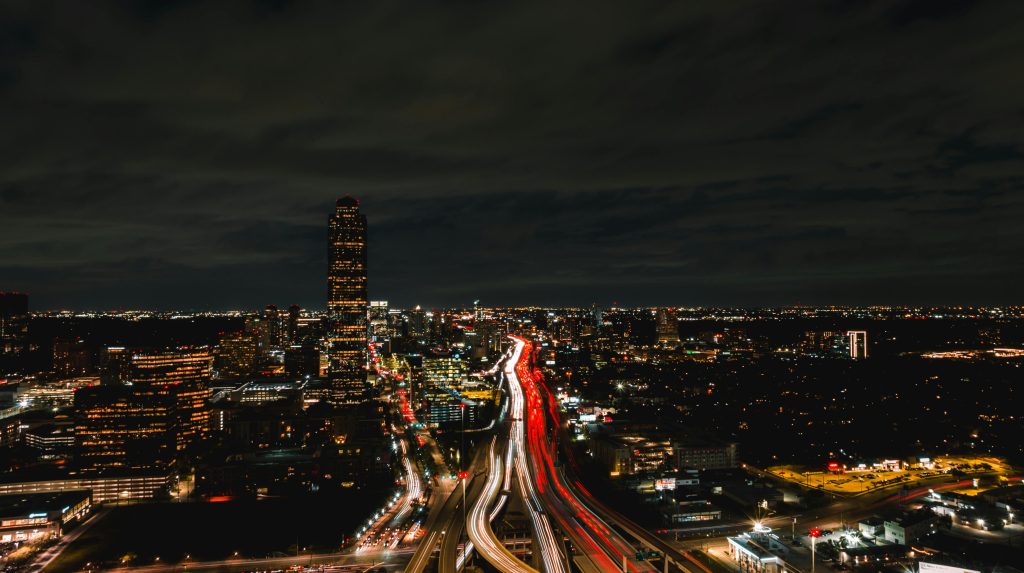 Houston skyline at night with highway traffic