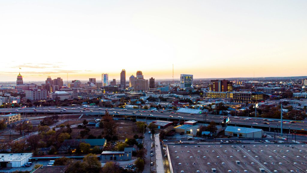 San Antonio skyline with highway traffic at sunset