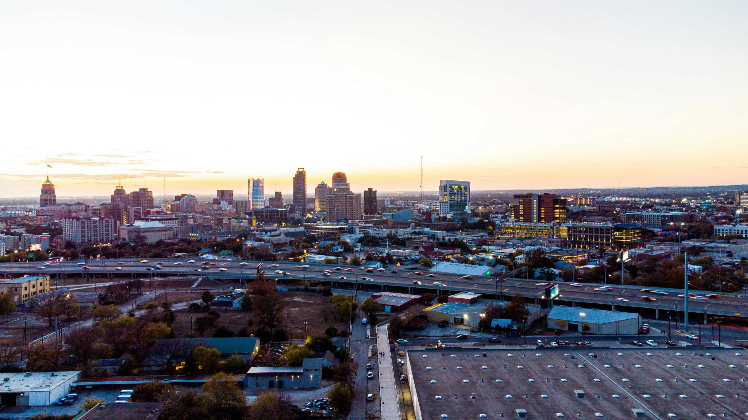 San Antonio skyline with highway traffic at sunset