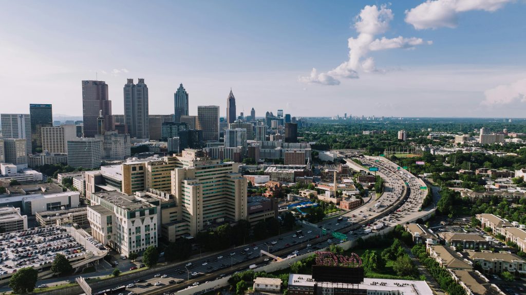 Atlanta skyline and highway traffic for Georgia car insurance requirements