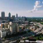 Atlanta skyline and highway traffic for Georgia car insurance requirements
