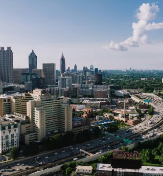 Atlanta skyline and highway traffic for Georgia car insurance requirements