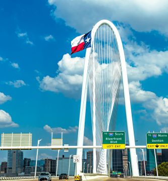 Margaret Hunt Hill Bridge in Dallas with Texas flag