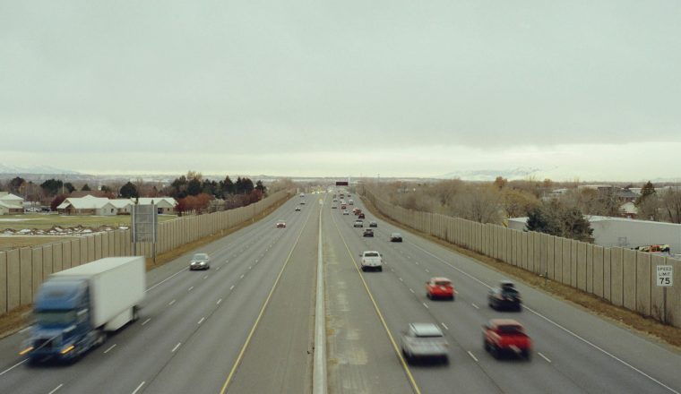 Cars driving on a highway for a Georgia car insurance guide